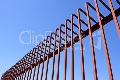 Fence with bent metal rods