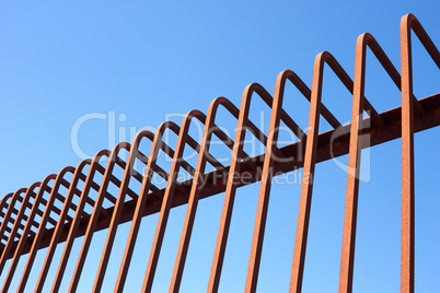 Metal fence with bent rods