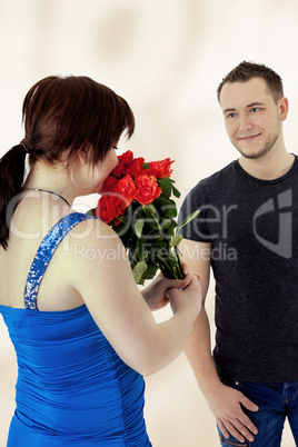 Woman gets flowers from man