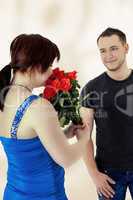 Woman gets flowers from man