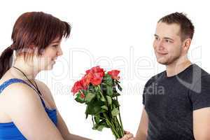 Woman gets flowers from man