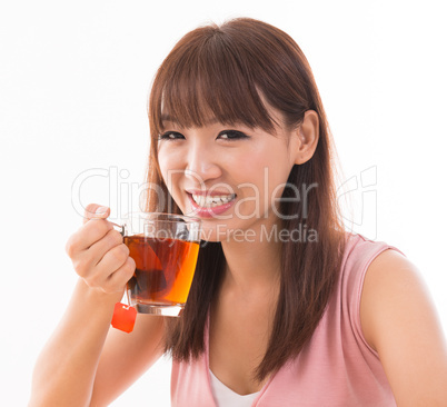 Asian female drinking tea