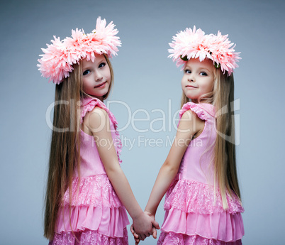 Pretty little girls in pink dresses