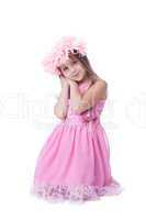 Beautiful little girl in pink dress and garland