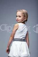 Pretty blonde little girl in white dress