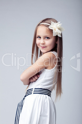 Pretty blonde little girl in white dress