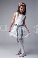 Pretty little girl in white dress