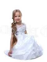 Pretty blonde kid portrait in white dress isolated
