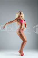 Athletic blond woman posing in bikini