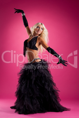 athletic blond woman posing in east style costume