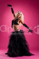athletic blond woman posing in east style costume