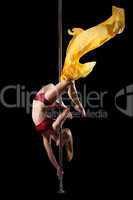 Woman show exercise in pole dance with fabric