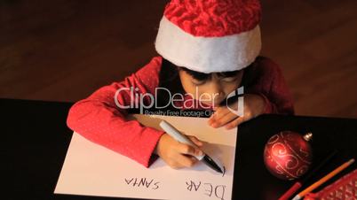 Six Year Old Girl Writing Santa Claus