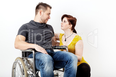 Man in wheelchair and his girlfriend is worried