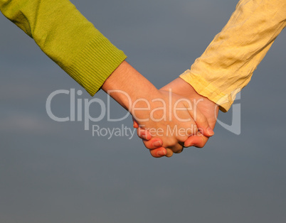 Teen girls holding hands