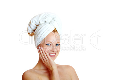 portrait of a beautiful blonde with white towel on her head