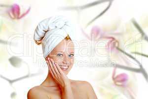 portrait of a pretty blonde with white towel on her head