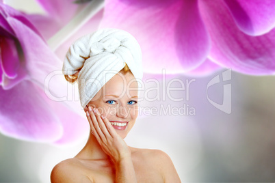 portrait of a pretty blonde with white towel on her head