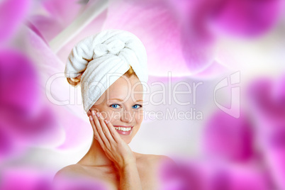 portrait of a pretty blonde with white towel on her head