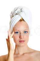 portrait of a beautiful blonde with white towel on her head