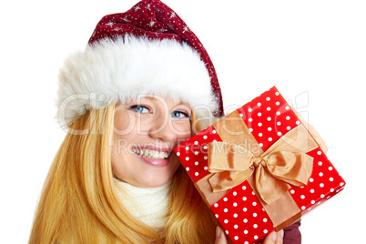 beautiful blonde woman holding a christmas gift is smiling