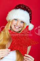 beautiful blonde girl wearing a christmas hat is smiling