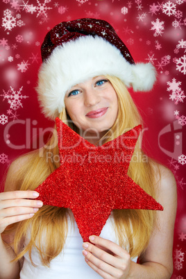 beautiful blonde woman holding a christmas gift is smiling