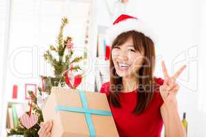 Excited Asian getting her Christmas present