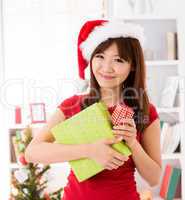 Asian Christmas woman with gift