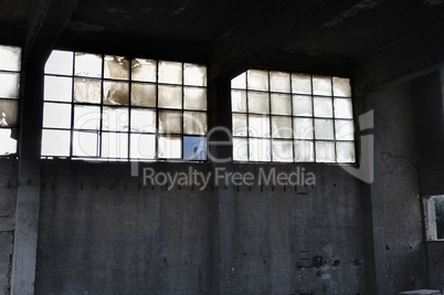 windows and concrete wall in factory interior