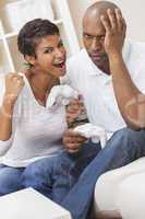 African American Couple Playing Video Console Game