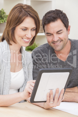 Happy Man & Woman Couple Using Tablet Computer at Home