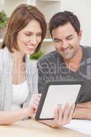 Happy Man & Woman Couple Using Tablet Computer at Home