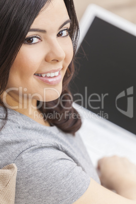 Happy Hispanic Woman Using Laptop Computer