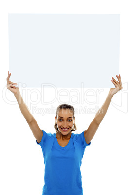 Woman holding up blank white ad board