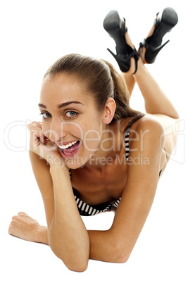 Excited female bikini model with cheeky expression