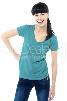 Trendy lady posing in style and flashing a smile Trendy lady posing in style and flashing a smile