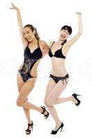 Sexy bikini ladies in joyous mood rejoicing together