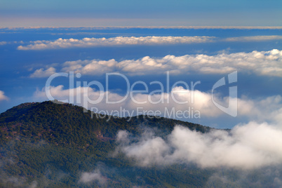 Hill and sea in clouds