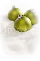 Green Christmas Ornaments on Snow Flakes with Text Room