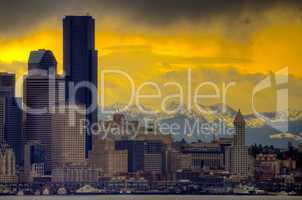 Downtown Seattle with dramatic sky and Cascade Mountains in the