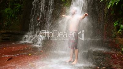 taking a shower in waterfall