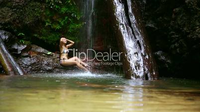 sexy girl lying down in river
