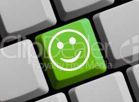 Fröhliches Gesicht auf Tastatur