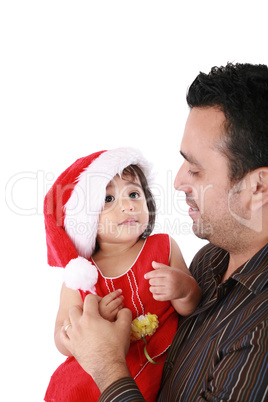 Father and daughter looking happy wearing santa Christmas hat.