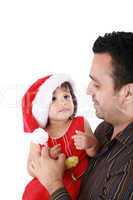 Father and daughter looking happy wearing santa Christmas hat.