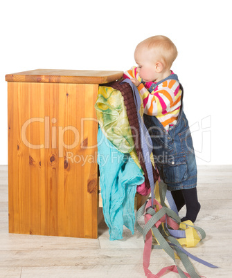 Determined toddler balancing on tiptoe