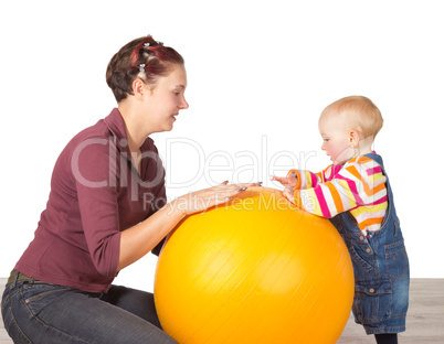 Mother and baby with a gym ball