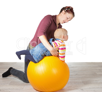 Mother exercising her young baby