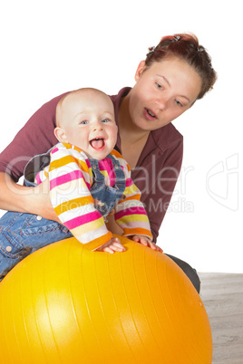 Laughing baby doing exercises